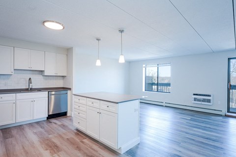an empty kitchen and living room in an apartment
